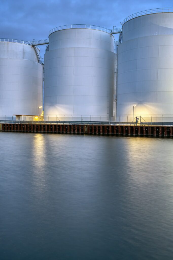 Big oil storage tanks at dusk